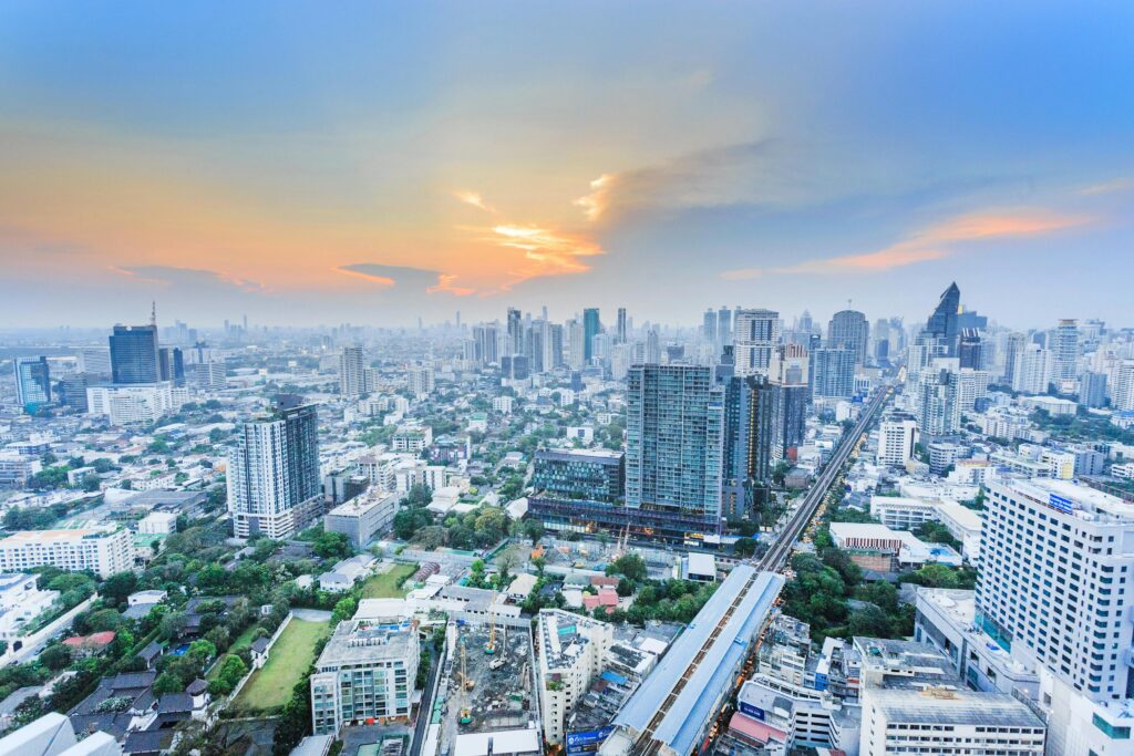 Stunning aerial view of Bangkok cityscape during twilight, showcasing the city's modern skyline.